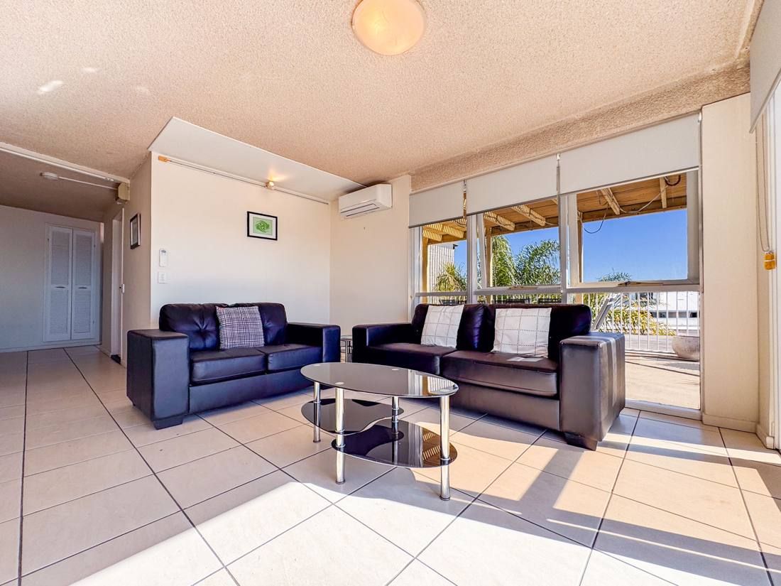Comfort apartment living area with ocean-facing balcony
